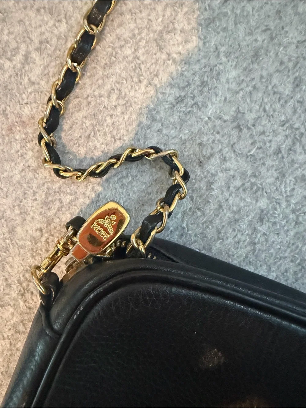 MCM Black Leather Shoulder Bag with Gold Accents